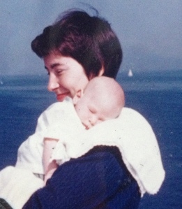 mom holding me at beach